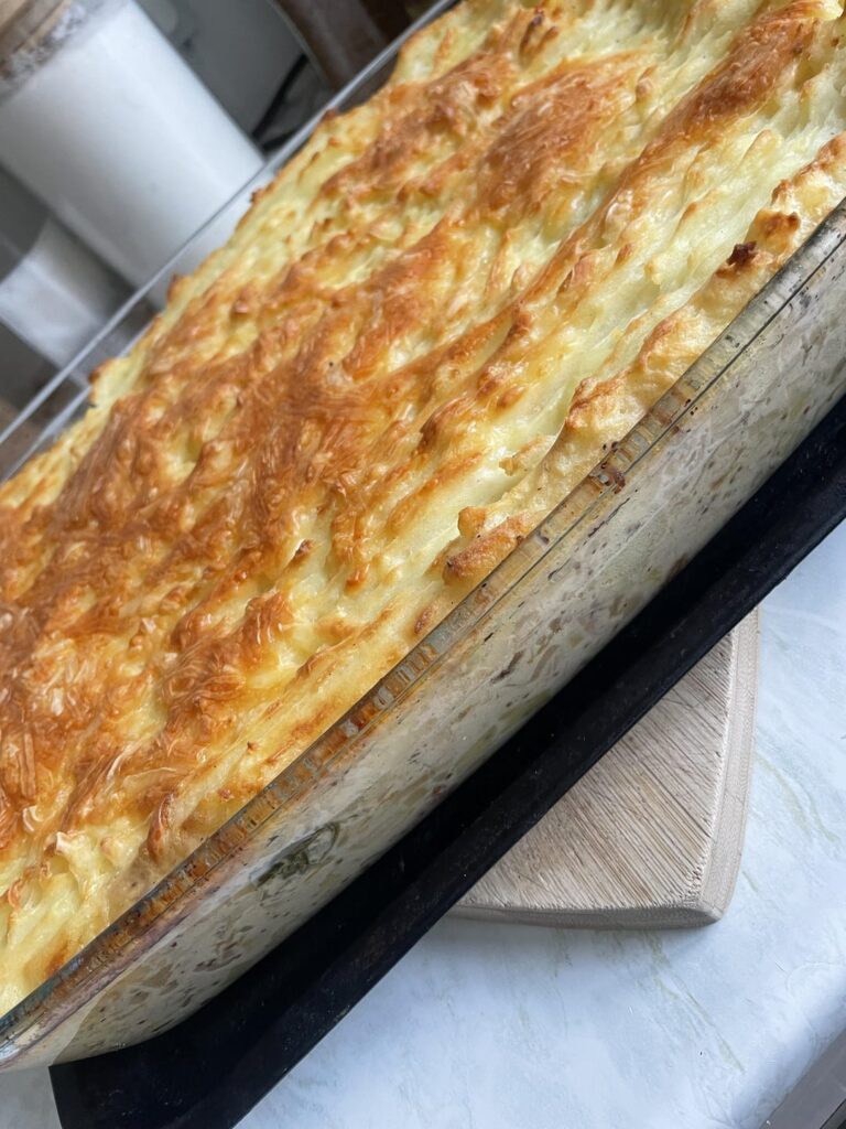 Creamy chicken, bacon and leeks topped with mash and cheese Creamy chicken, bacon and leeks topped with mash and cheese