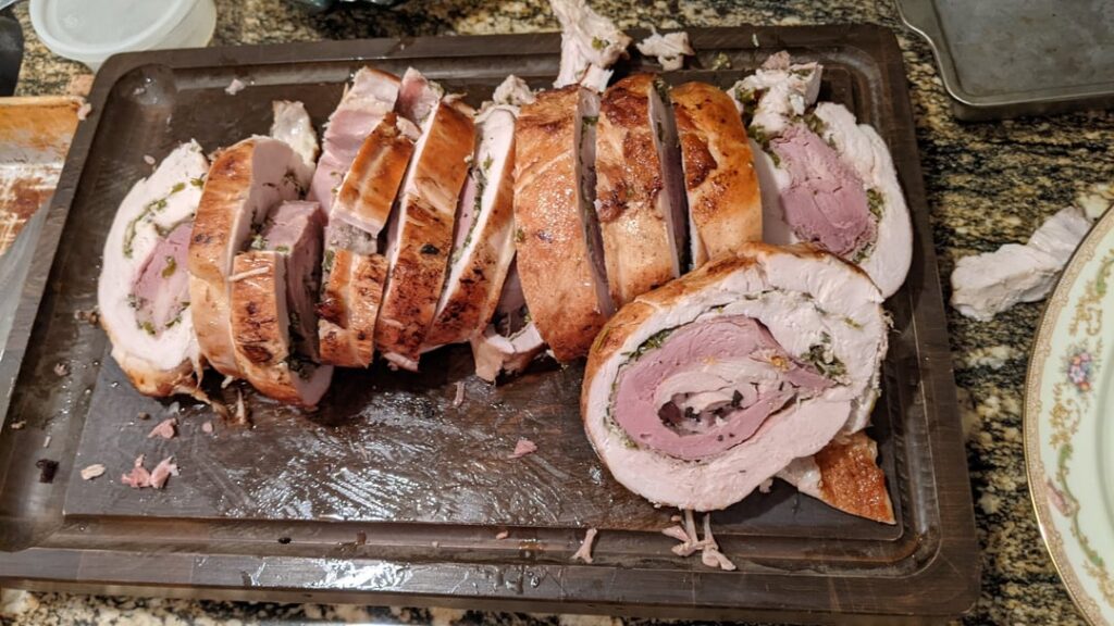 I made a Turducken roll! Sage butter chicken, orange and brown sugar duck wrapped in prosciutto and lemon + herb w/ confit garlic turkey. 8 hours at 150f