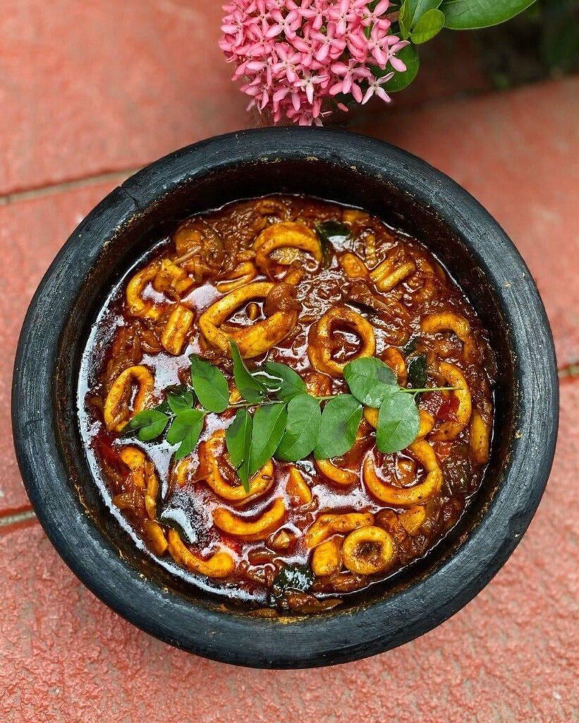 Slow cooked Spicy Squid curry in a clay pot