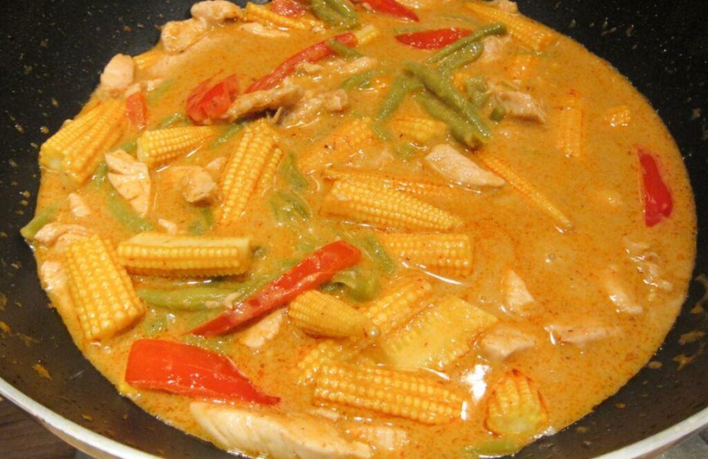 red curry chicken with baby corn and bell peppers