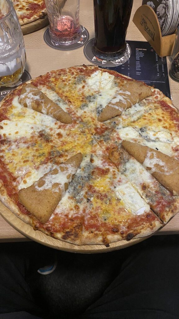 A pizza with mayonnaise and grilled cheese "smažák" topping.