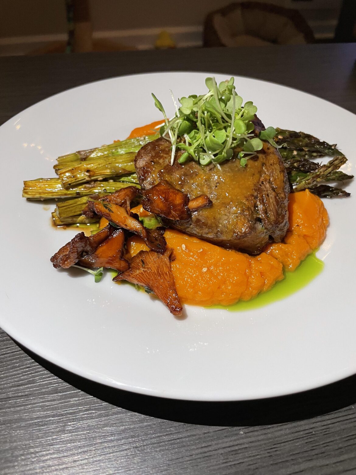 Miso glazed filet, yuzu sweet potatoes, sesame asparagus, and sake glazed chanterelles.