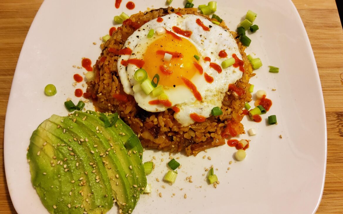 Topped my kimchi bacon fried rice with fried egg and side of sliced avocado