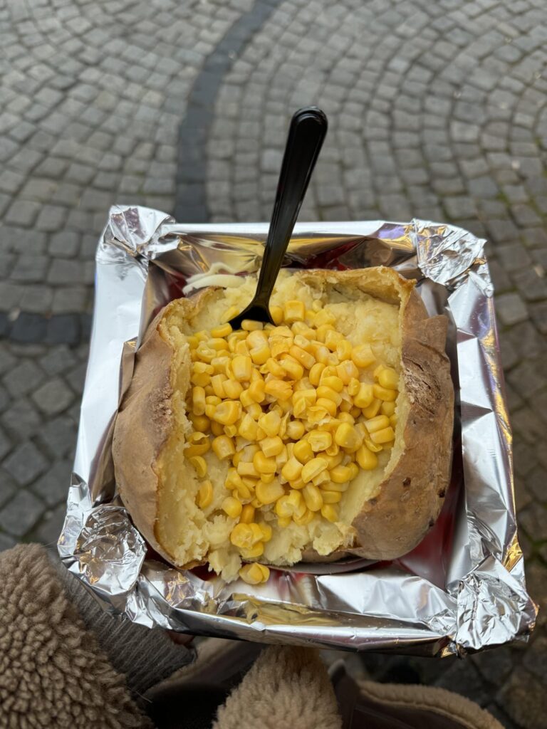 calories for this baked potato with butter (about 1 tablespoon?), shredded mozzarella cheese (maybe 1/2 cup?), and corn?