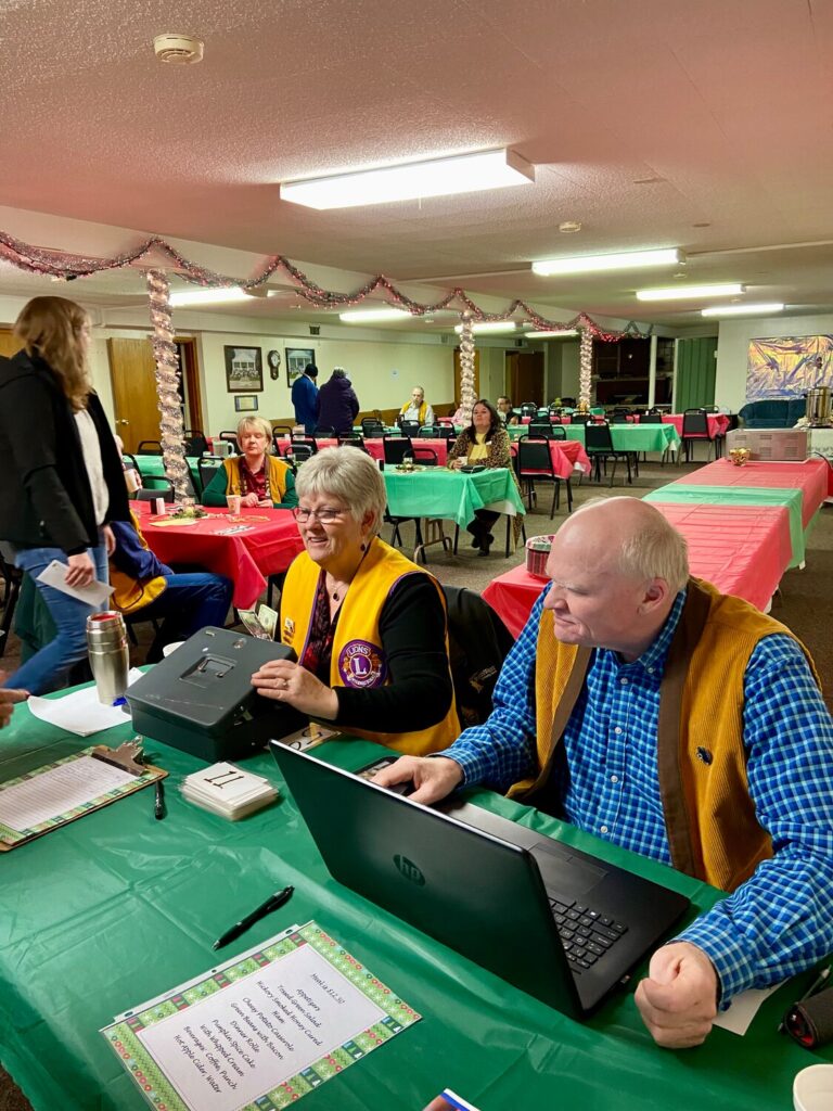 The Lingle-Ft. Laramie Lions Club annual dinner and Christmas gift auction was held last week. The event featured a ham dinner, dessert and an auction with proceeds going to the Allen H. Stewart Lion Camp, located on Casper Mountain, for the blind and visually impaired. Members of the Lingle-Ft. Laramie FBLA and auctioneer Terry McIntosh helped the club gather over $5,000 for the camp. Miss Merry Christmas 2024, Sarah Birdsall, and her mother, Heather, also attended the event.