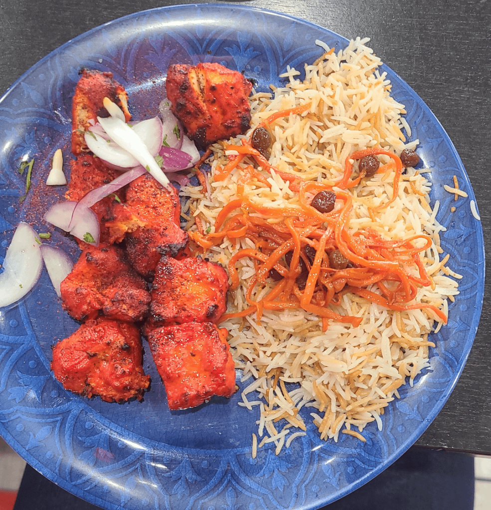 Chicken breast pieces with greasy rice