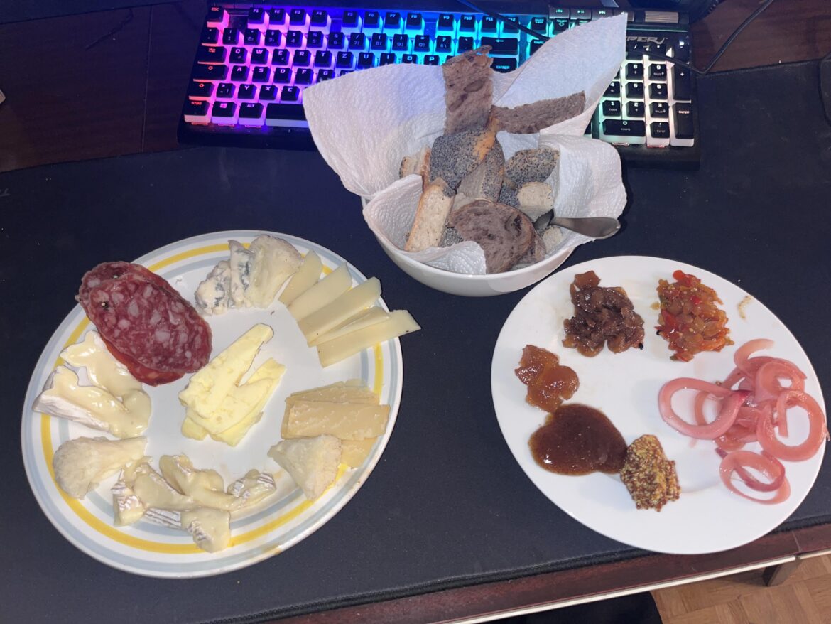 Little evening snack with leftover cheeses and condiments from a bday