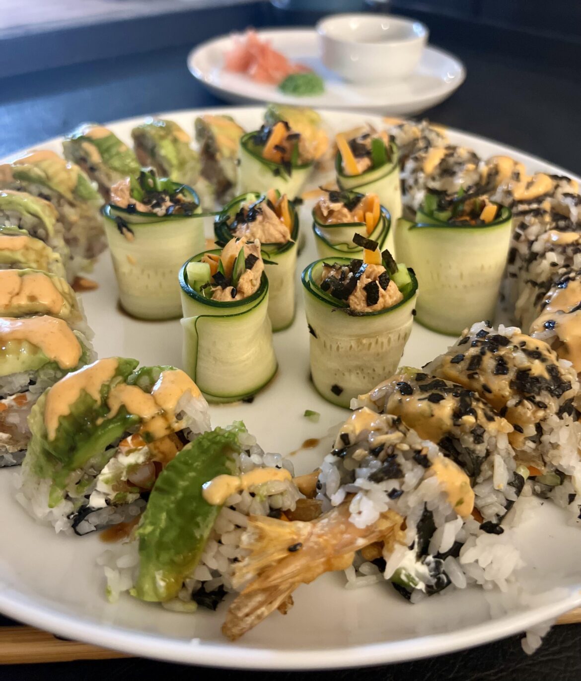 Sushi on a budget- frozen shrimp tempura roles and a spicy canned tuna wrapped with zucchini with home made sauces : eel and spicy mayo  💸