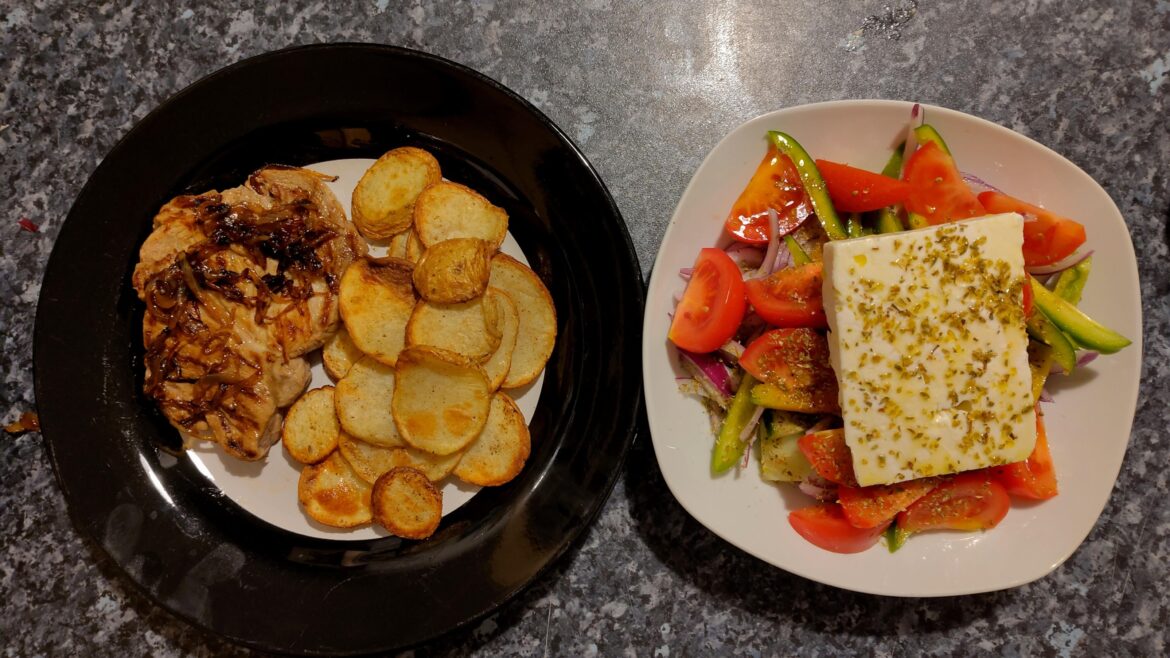 Pork shoulder steak with Mustard rub. Caramelised whisky onions, chips and a Greek salad