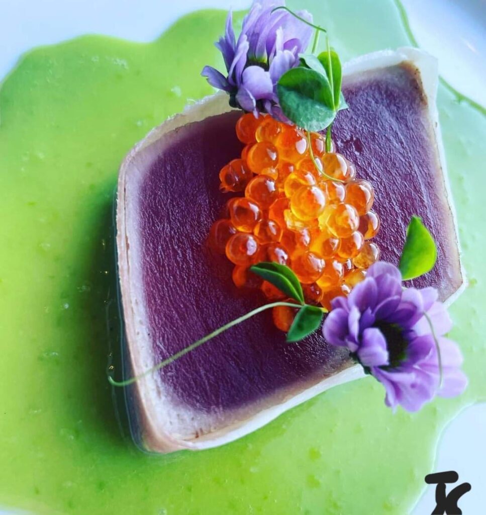 Yellow fin. Pea and bacon fat emulsion. Blood orange and chili faux caviar