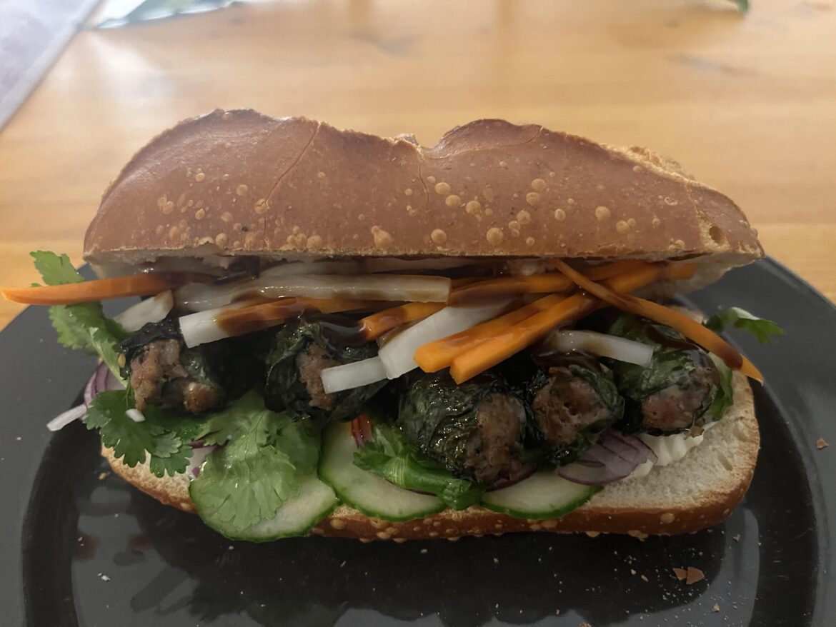 Banh mi with Bo la Lot, pickled carrot and radish, cucumber, red onion, hoi sin and homemade mayonnaise on french bread