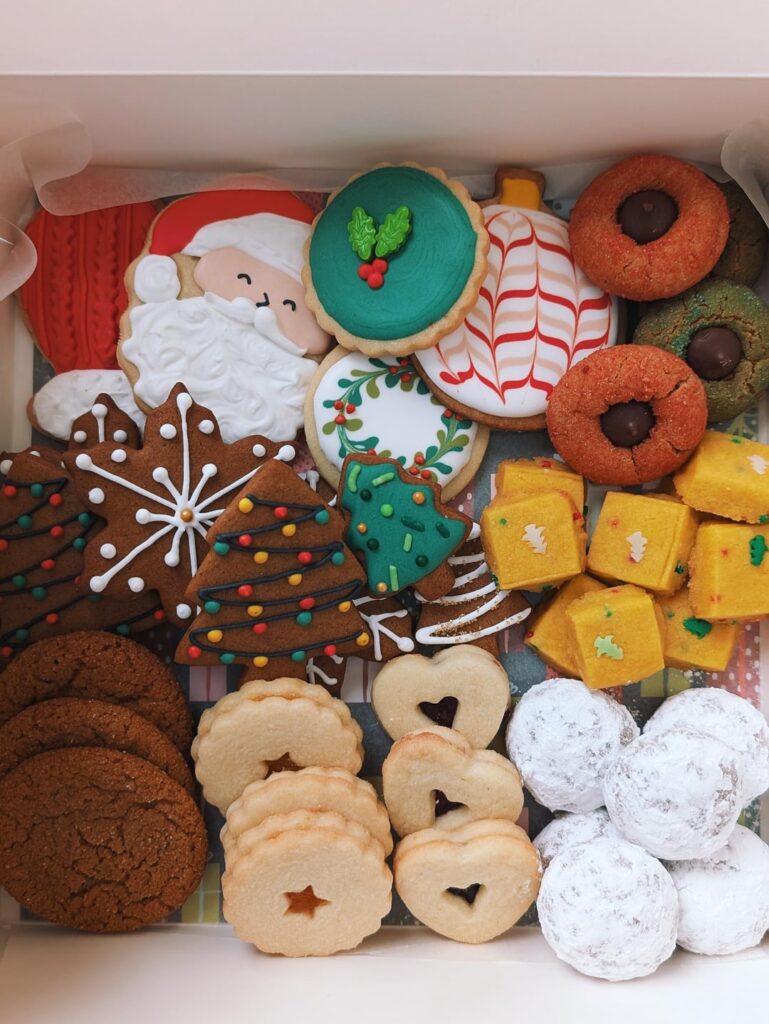 Baking with a one year old is difficult but I somehow assembled my Christmas cookie boxes