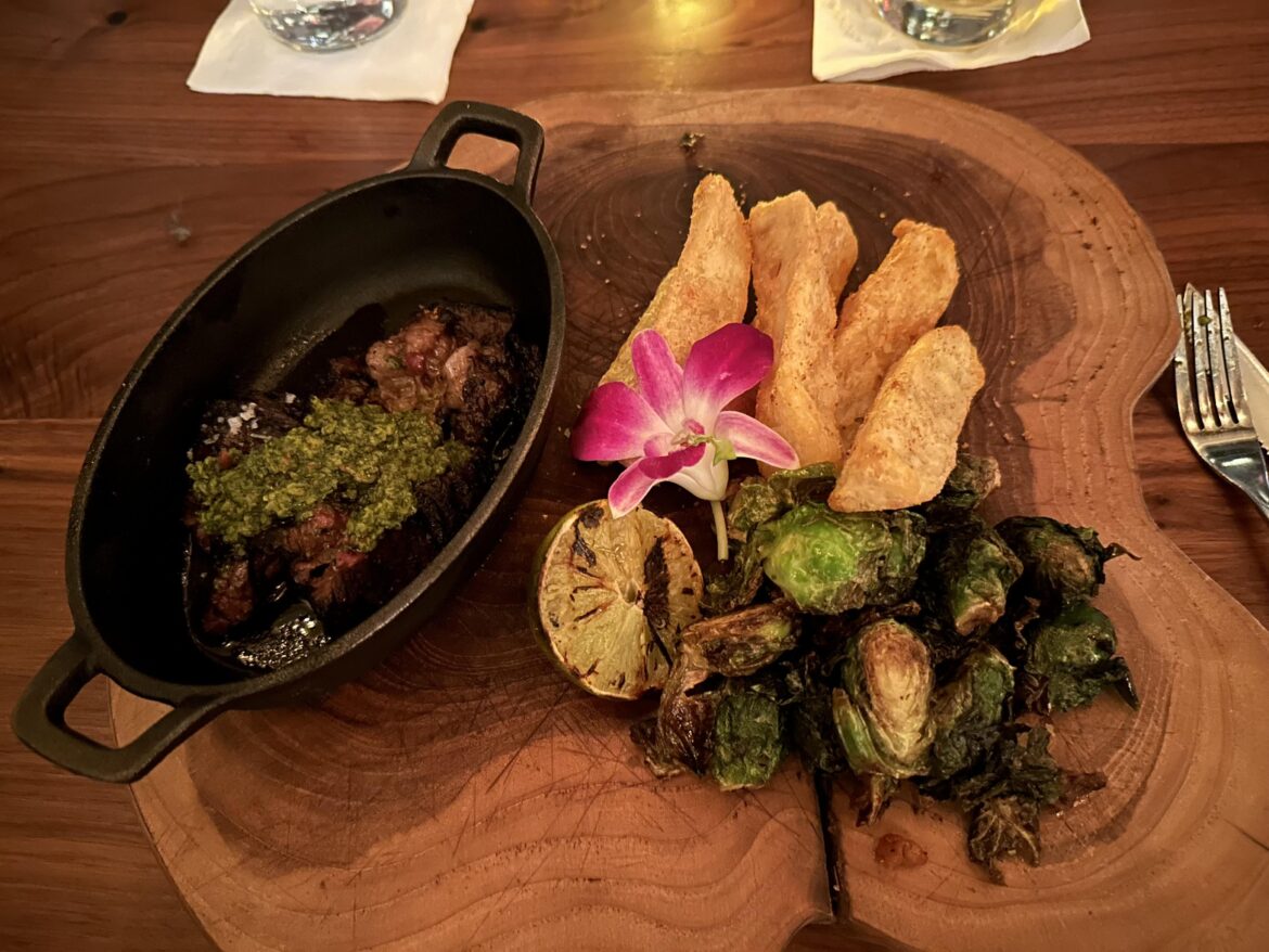 Chimichurri steak on a log slab