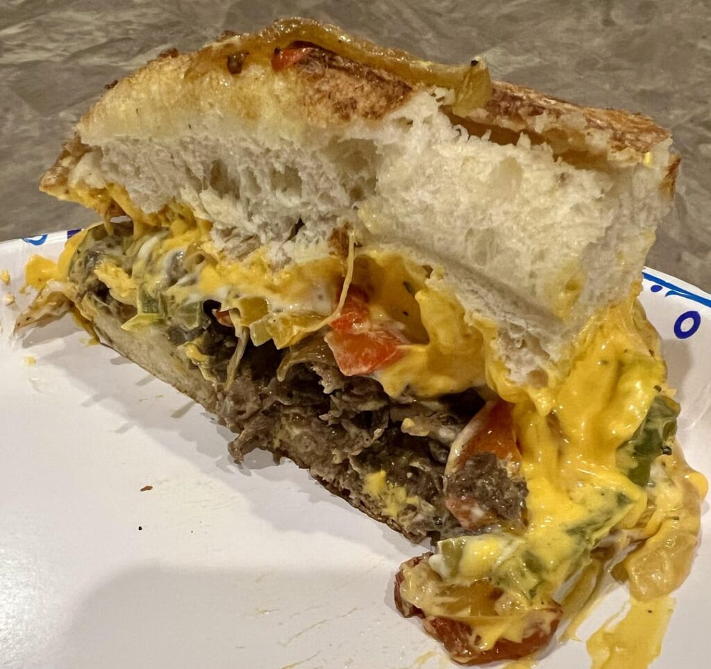 Steak, whiz, onions, peppers, Colby Jack.