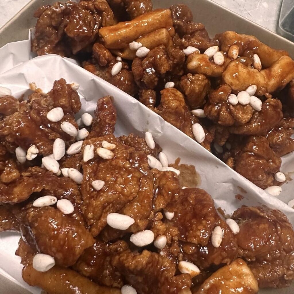 I love both the sweet and spicy sauce of the crispy fried chicken. Which is more popular internationally, dakgangjeong or Korean fried chicken?