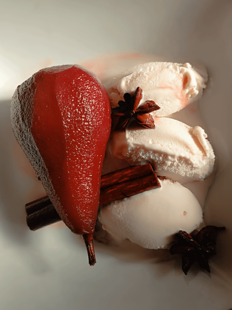 Poached pears with vanilla ice cream
