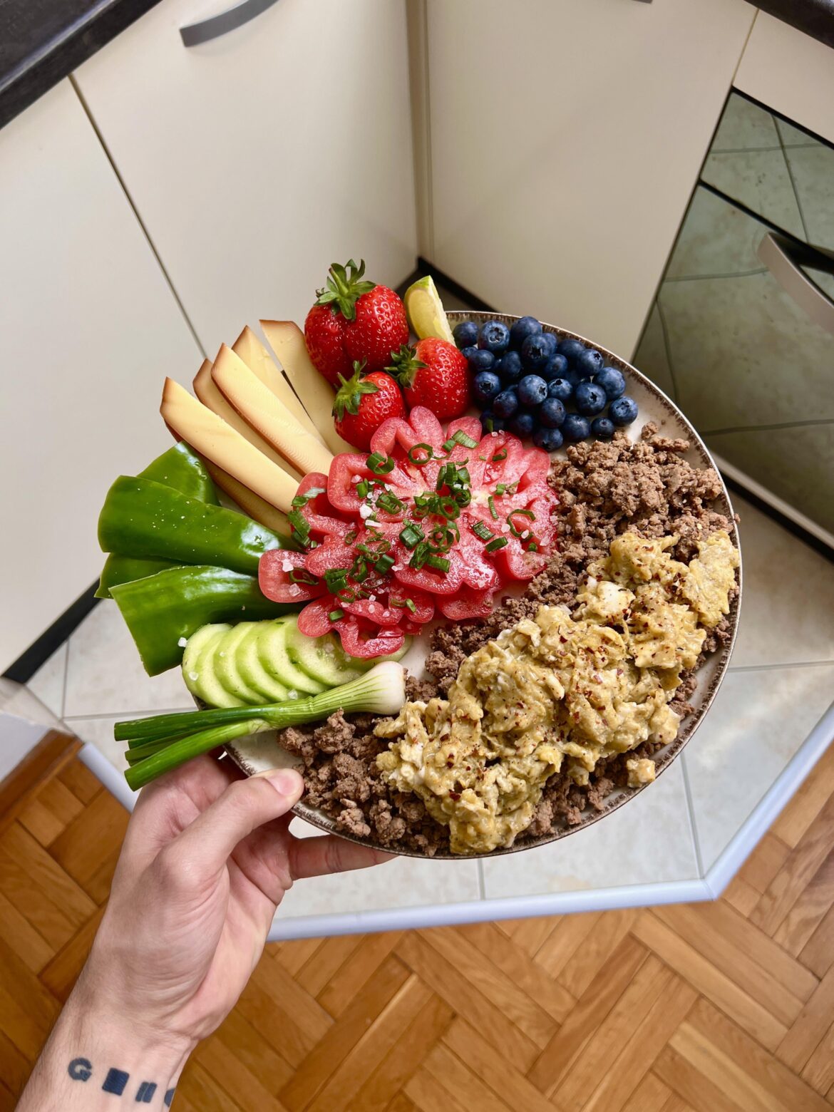 Some guy from the other sub told me to post this here. Ground beef with smoked cheese, fruits and vegetables, and scrambled eggs.