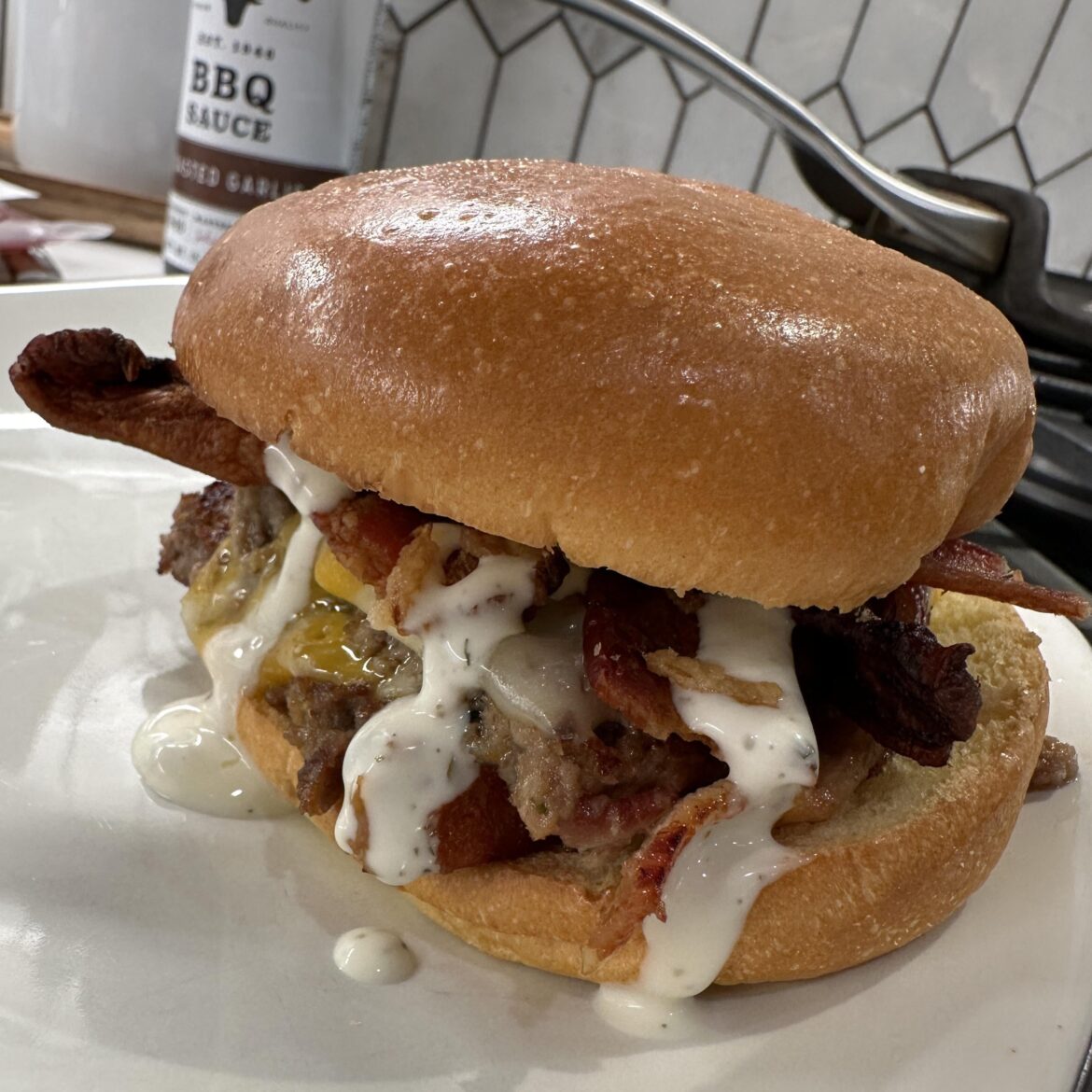 Meatloaf sandwich with bacon, pepper jack cheese, and crispy onions