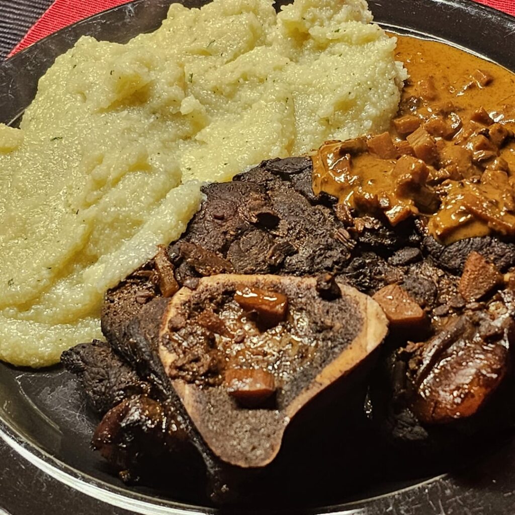 Ossobuchi, slow-cooked in red wine sauce, served with polenta