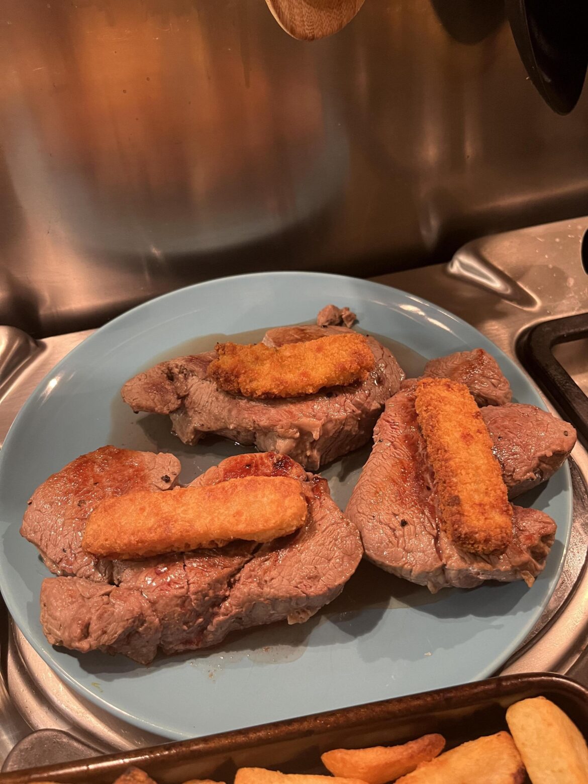 Surf & Turf: fillet steak with a fish finger, served with oven chips