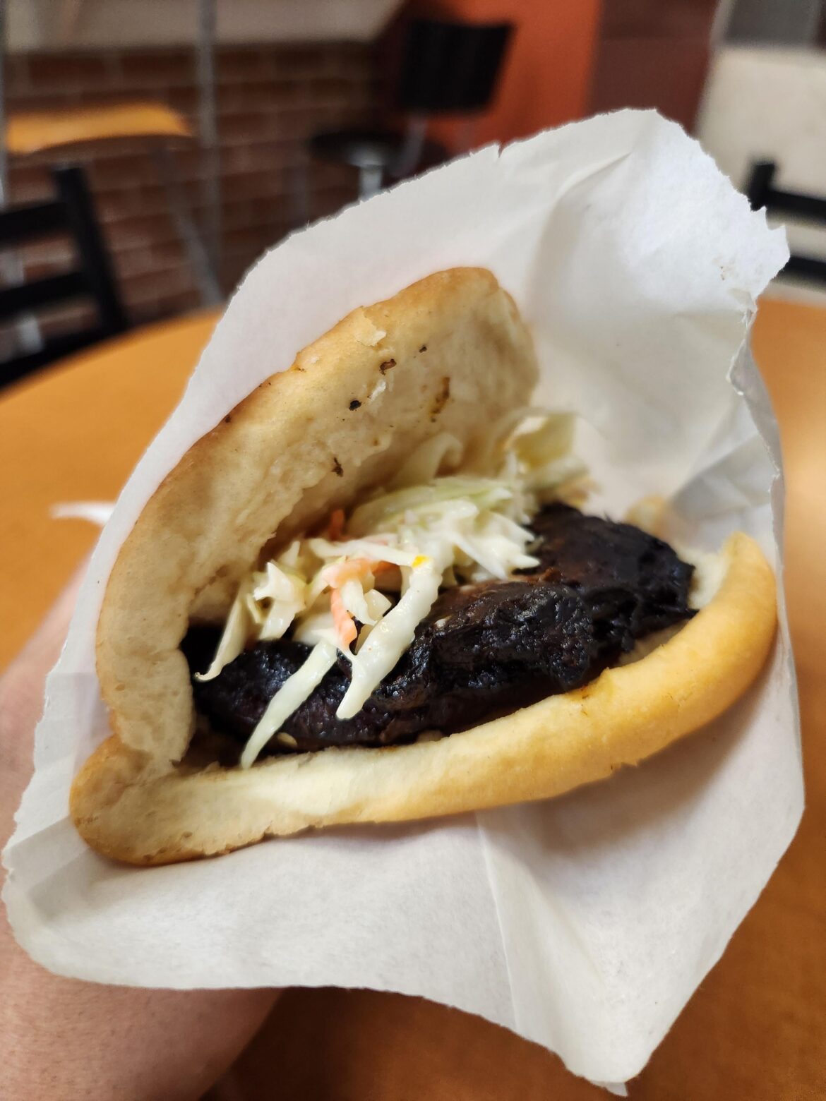 Jerk chicken on cocobread with coleslaw from Underhill Allwyn's Bakery