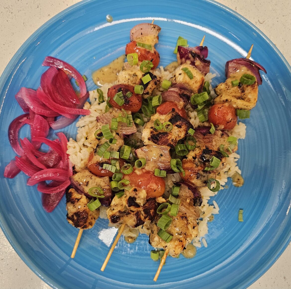 Marinated Chicken Shawarma Skewers with Onion & Tomatoes over Scallion Rice