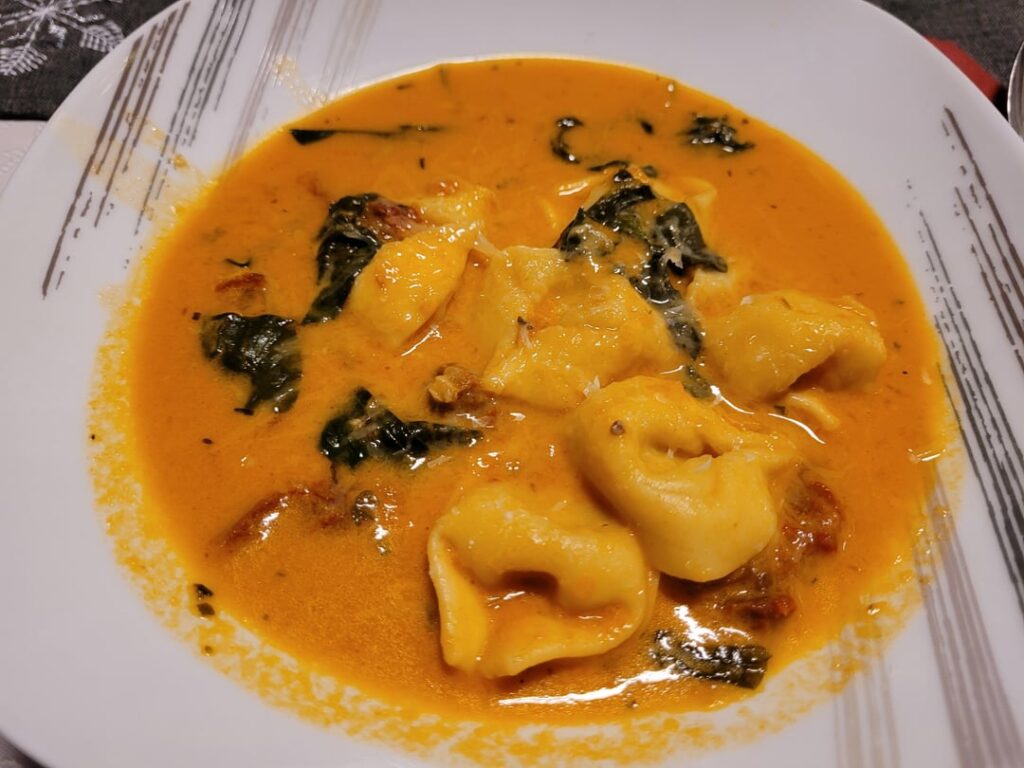 Tortellini Soup with tomato, basil, sun dried tomatoes and spinach
