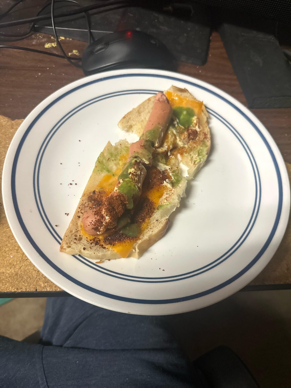 Chicken hot dog on sourdough with chews and el yucateco green habanero salsa