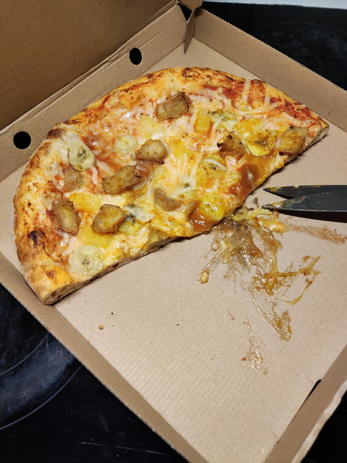 Chicken, banana, pineapple, mango chutney and cheese pizza