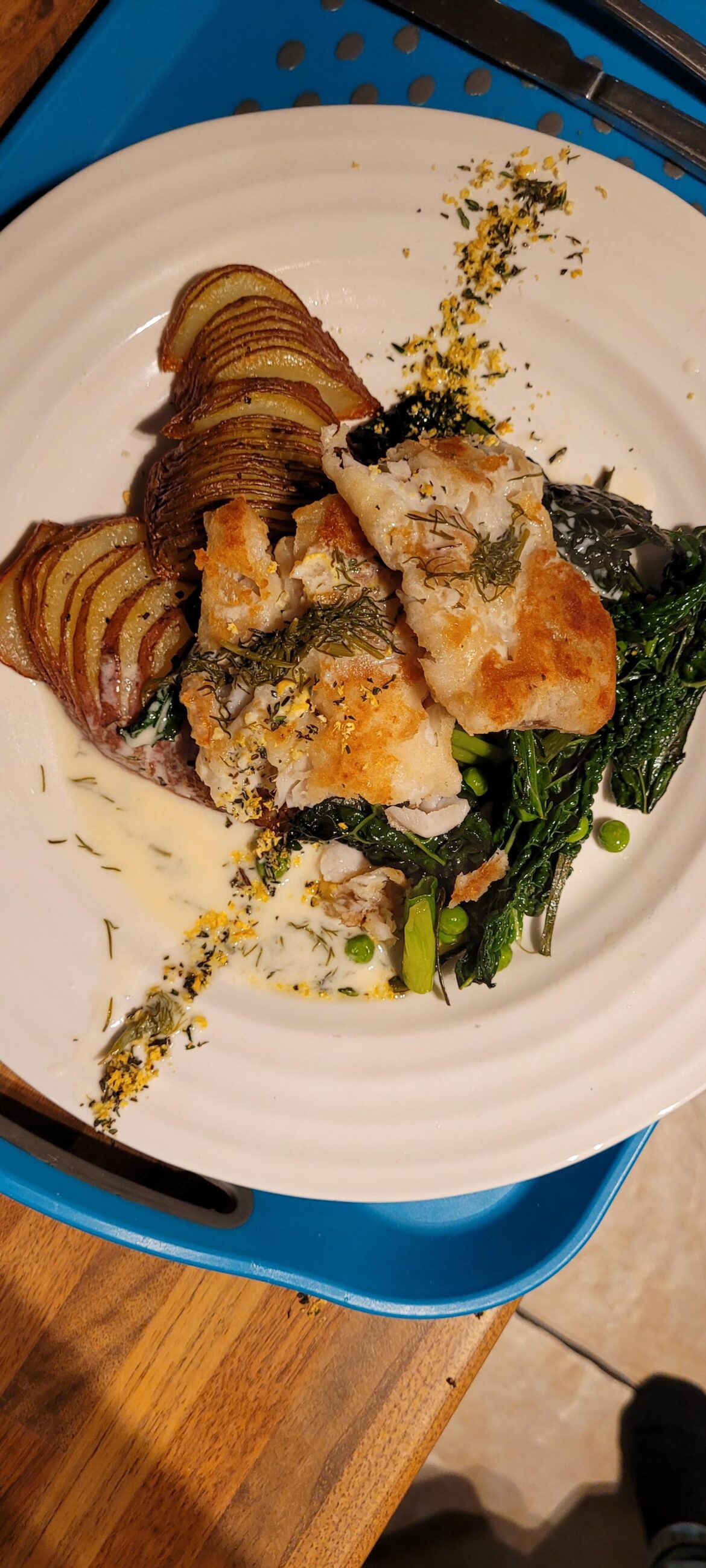 Floured & grilled Basa. Hasselback potatoes with Cavalo Nero