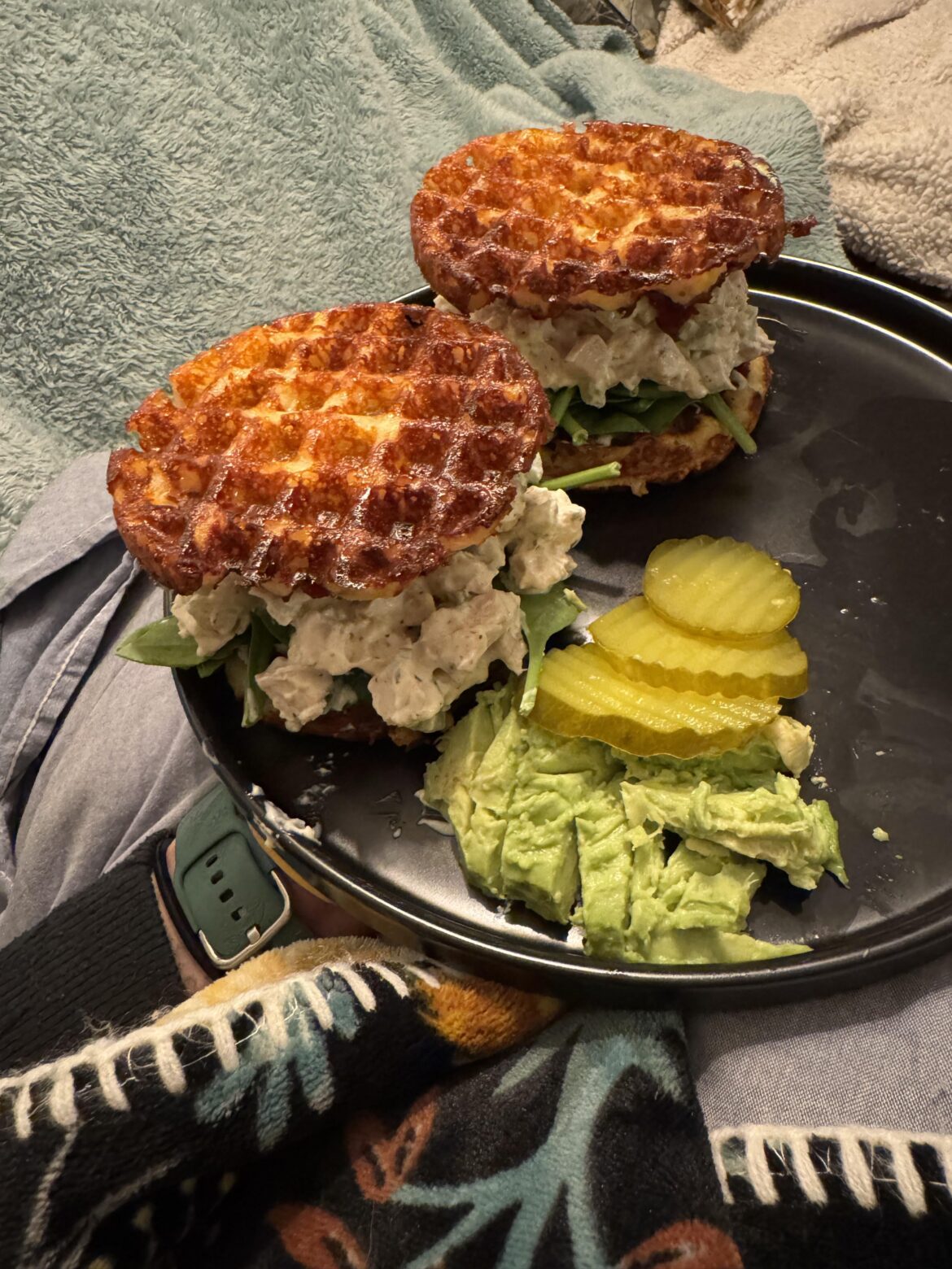 Chaffle sandwich with leftover TG turkey salad, keto cranberry sauce, havarti and spinach. Side of avocado and dill pickles.