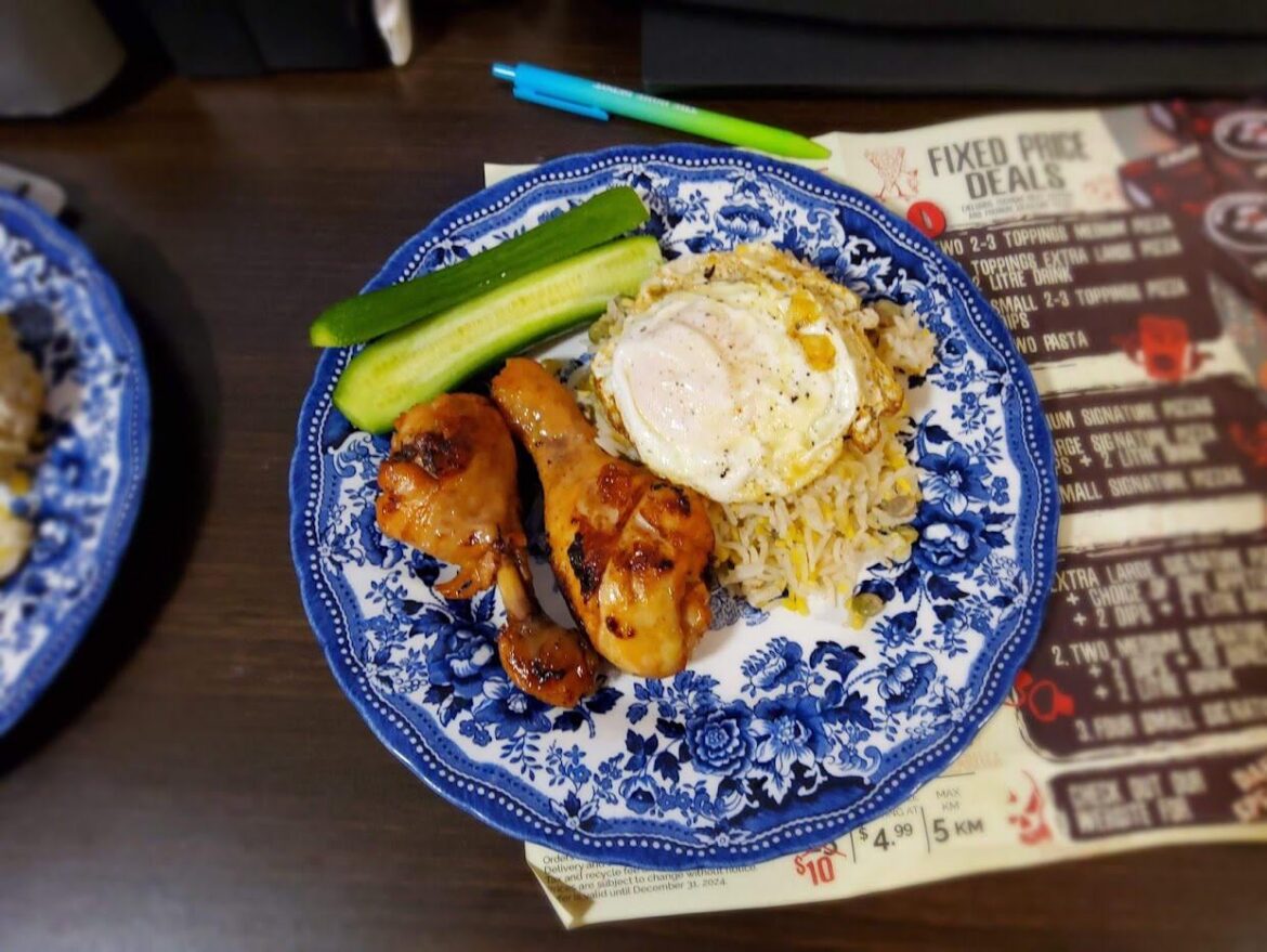 Rice, Chicken, a cucumber and of course an egg on it