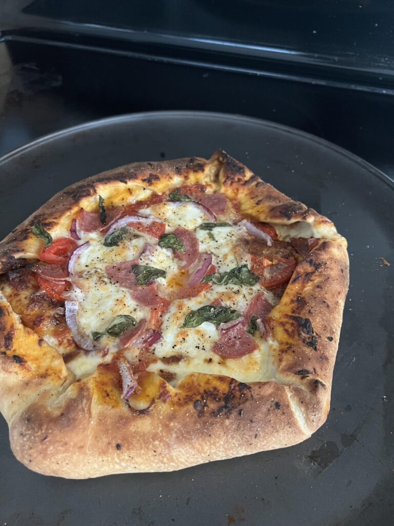Homemade cheese and caramelized onion stuffed crust pizza