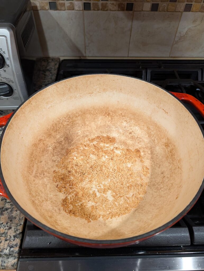 Add some rice in your cast iron to prevent over-baking the bottom of your sourdough.