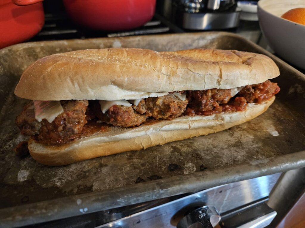 Leftover Christmas meatballs making a meatball Parm sub.