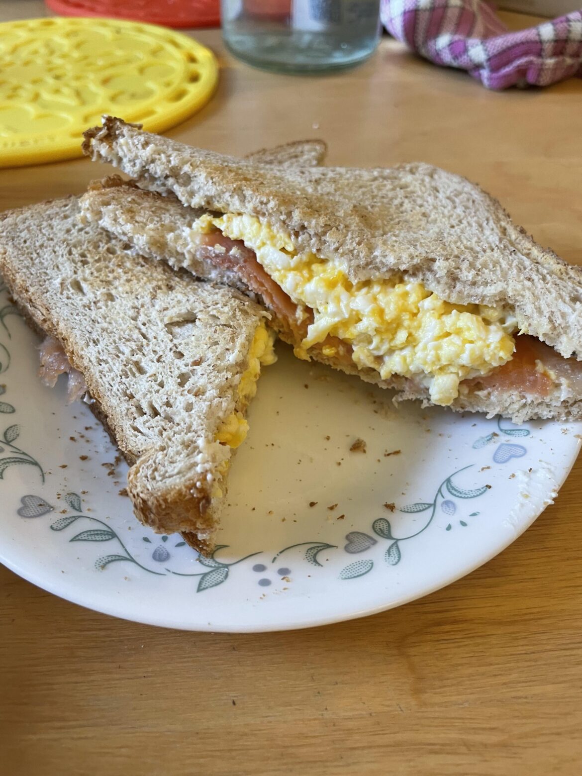 A little Christmas morning breakfast sandwich. Scrambled eggs, lox, cream cheese on whole wheat toast