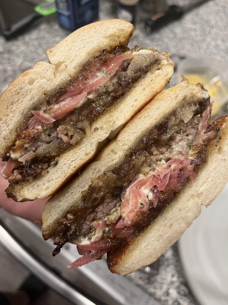 The wait is over. My love letter to the onion between a bun. The King of Onion burgers. Smash Burger topped with Shallot/Chive Goat Cheese, Bacon Onion Jam, Pickled Onions. Bun toasted with Chive Mayo. Absolute gorilla breath. Hope this scratches your nasty little bulbous itch. Love yall stay nasty. The wait is over. My love letter to the onion between a bun. The King of Onion burgers. Smash Burger topped with Shallot/Chive Goat Cheese, Bacon Onion Jam, Pickled Onions. Bun toasted with Chive Mayo. Absolute gorilla breath. Hope this scratches your nasty little bulbous itch. Love yall stay nasty.