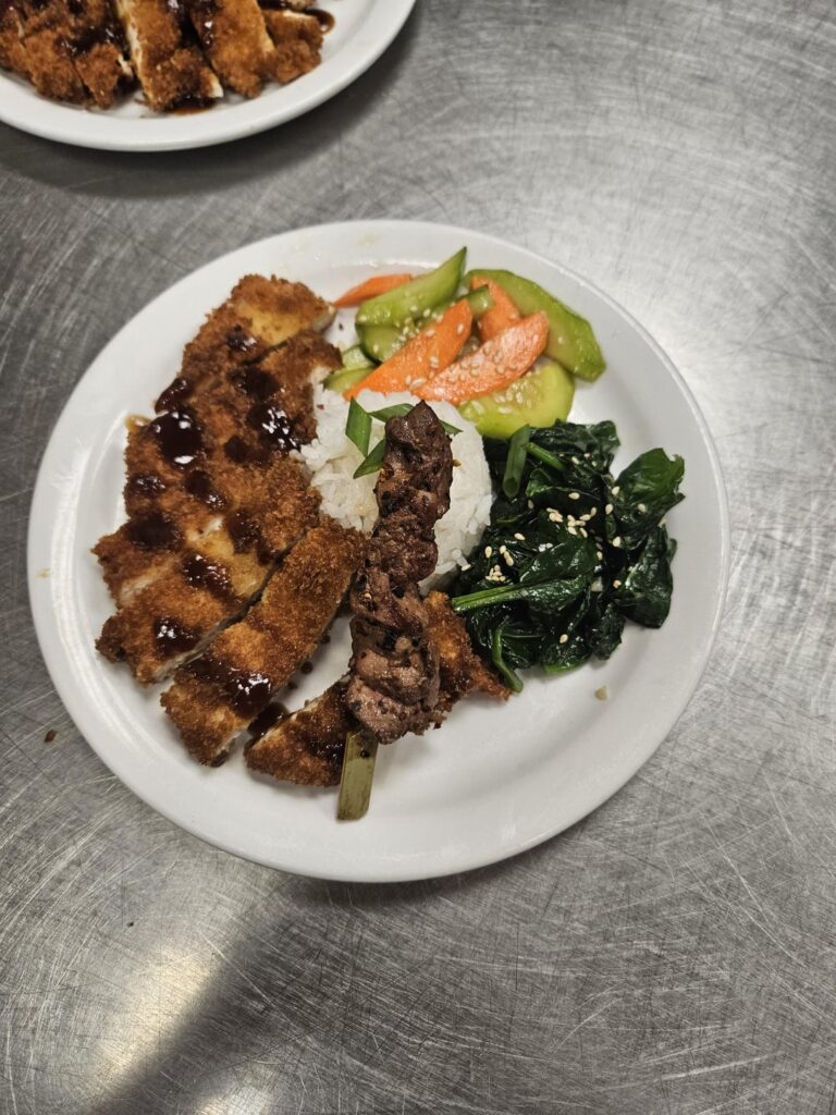 Chicken Tonkatsu with kombu rice, quick pickle salad, sauteed ginger garlic spinach, chicken liver yakitori