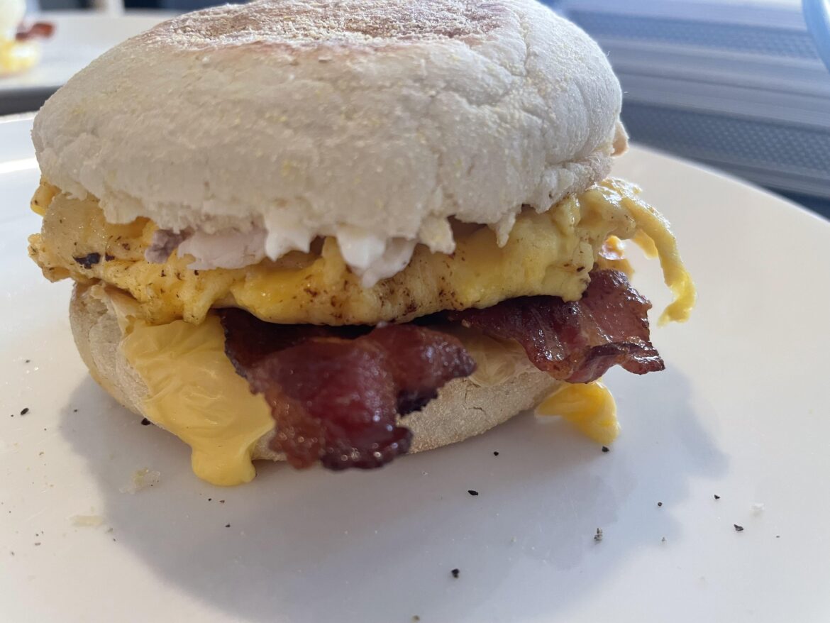 Bacon, egg and leftover Christmas turkey in an English muffin