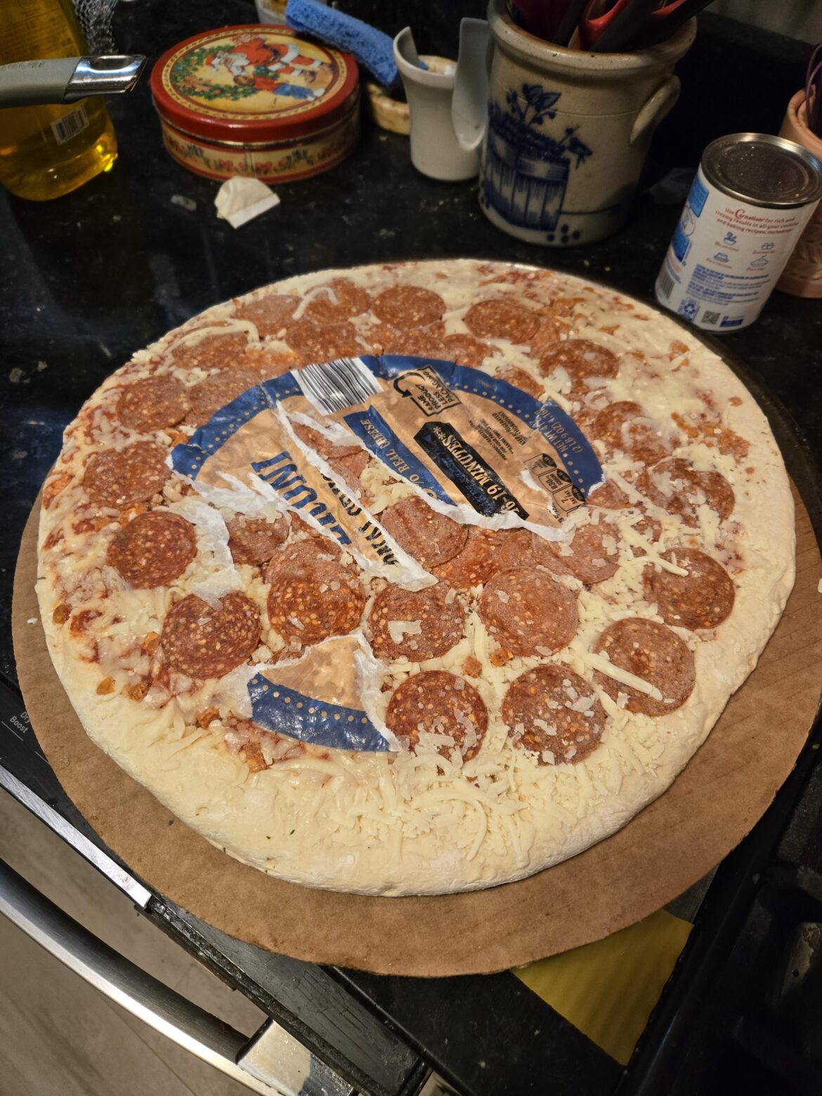 Who thought it was a good idea to put a paper sticker on frozen pizza?