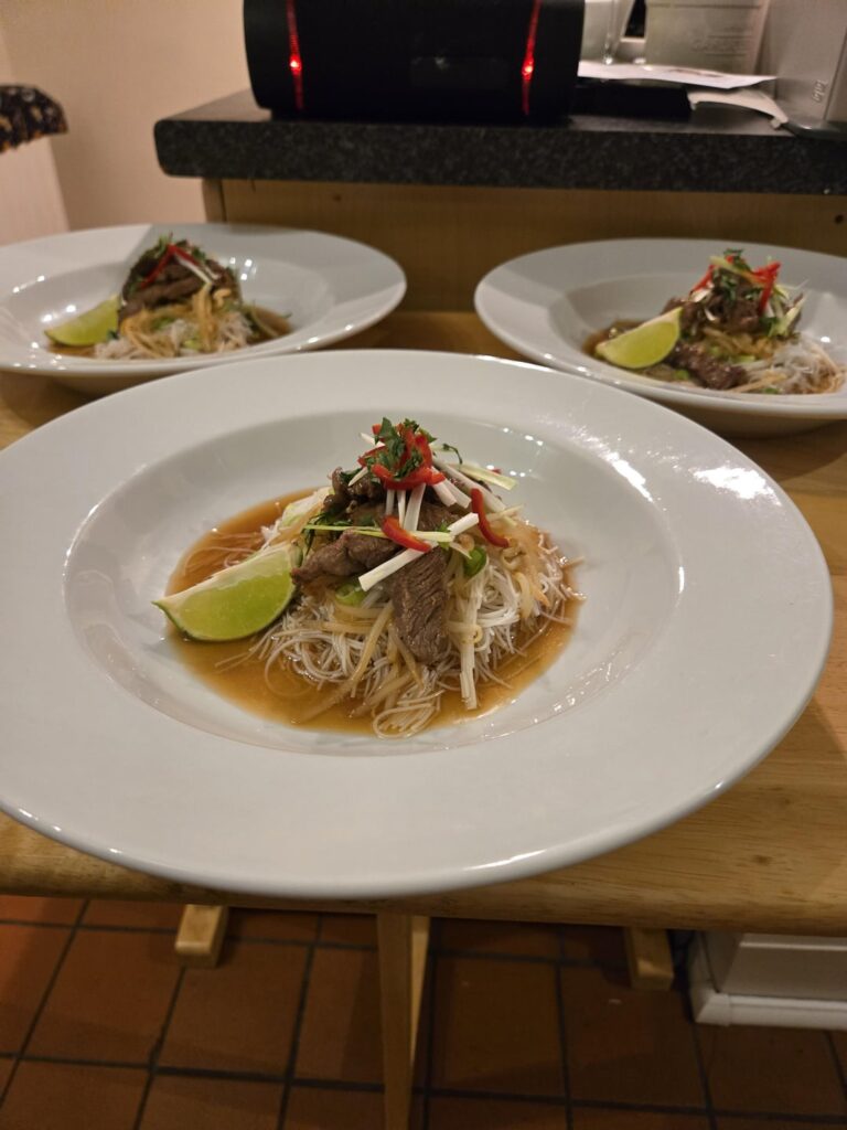 Thai beef, with rice noodle and broth. Also the brucey bonus of fat done in a sticky soy sauce.