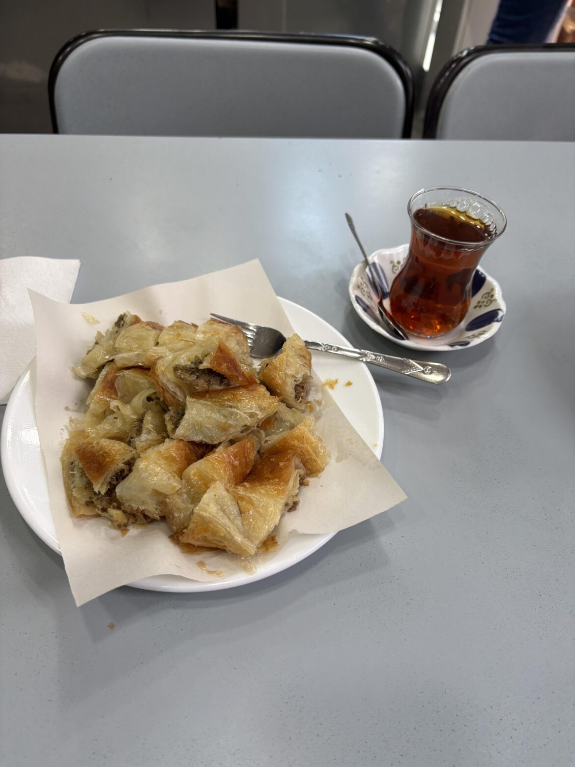 Börek and Turkish tea at a local spot in Istanbul, Türkiye
