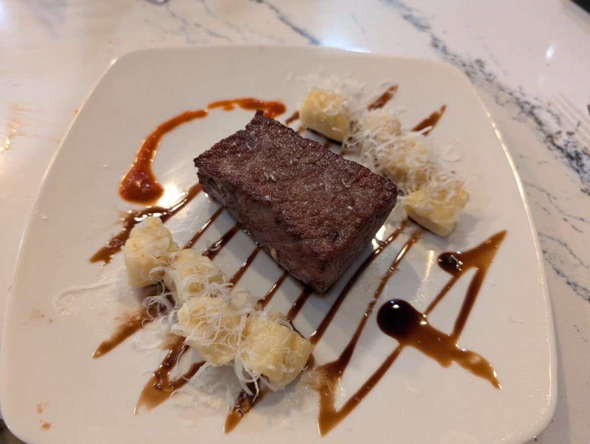 Smoked and seared tritip, ricotta gnocchi, balsamic reduction, Sriracha, and Parmesan.