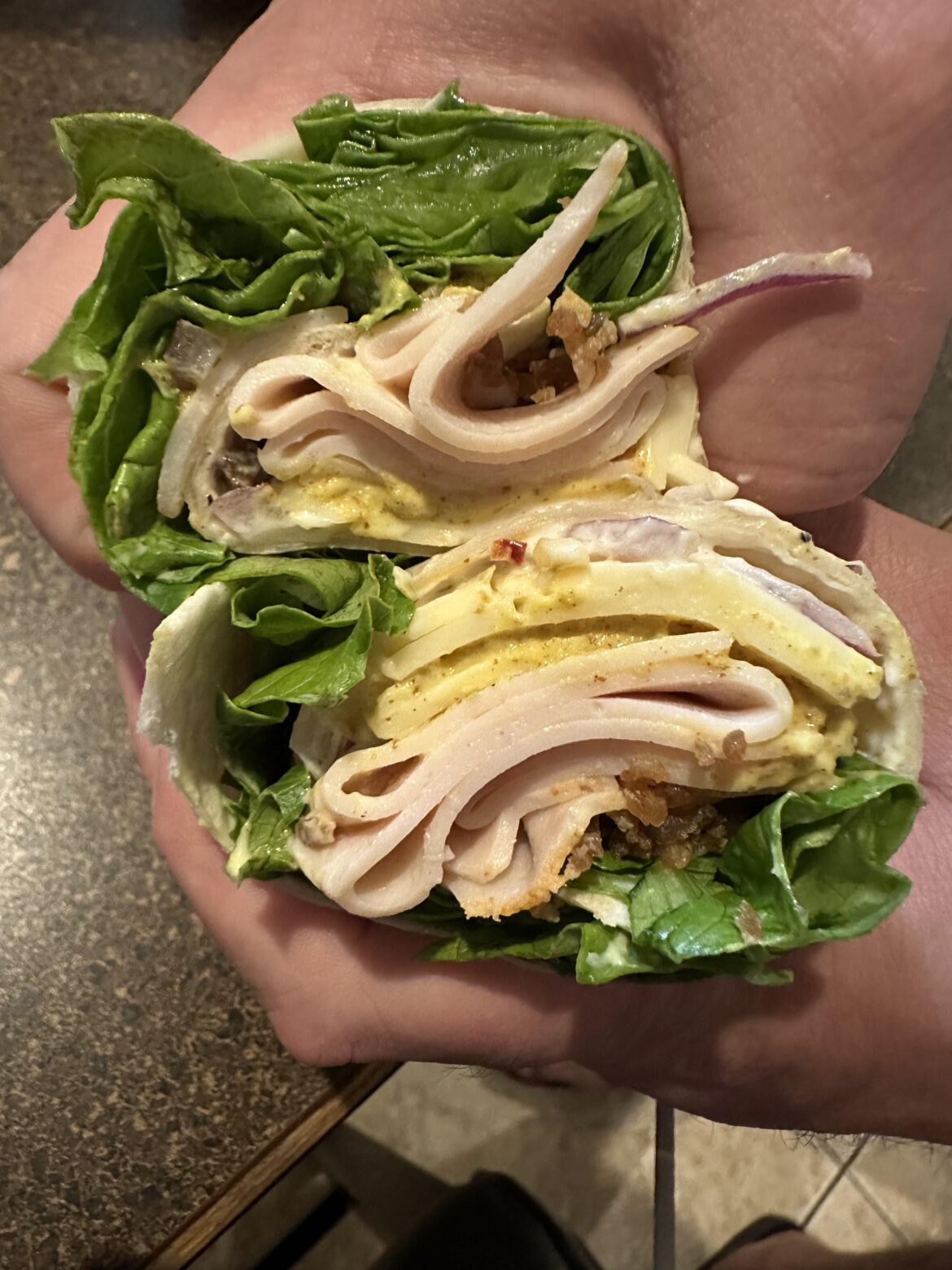 The what do we have around wrap. Chicken, Caesar, lettuce, red onion, habanero jack, bacon bits, green leaf, Guldens spicy brown. Actually quite good