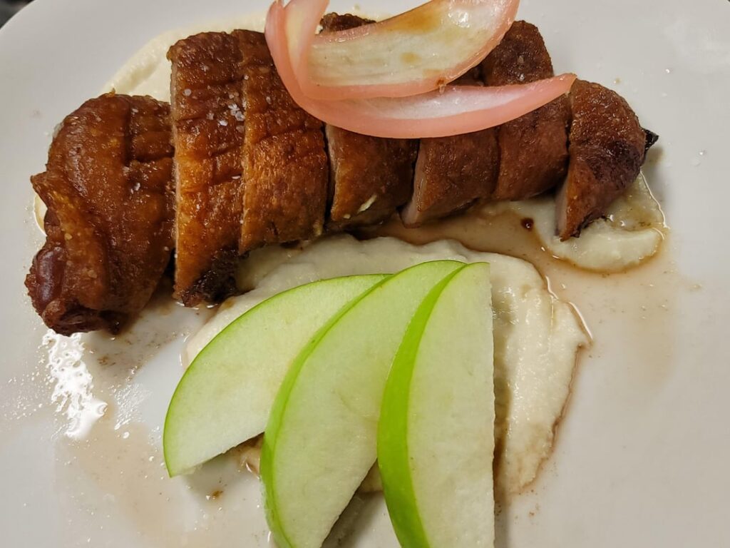 Dry aged tea smoked duck breast / Green apple Soubise / tea infused duck au jus / White onion petals pickled in beet juice