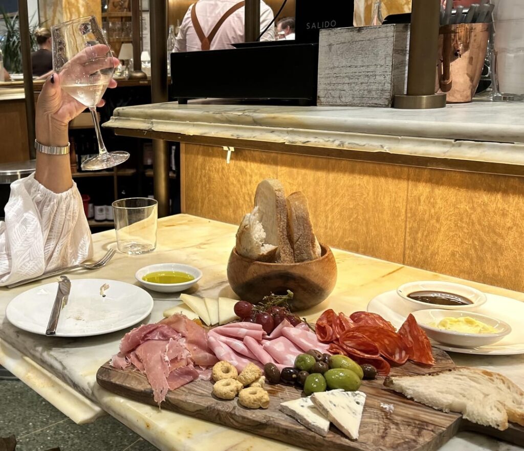Eataly (Flatiron location) offers a beautiful charcuterie board. Highlighted my top 2 cheese picks!
