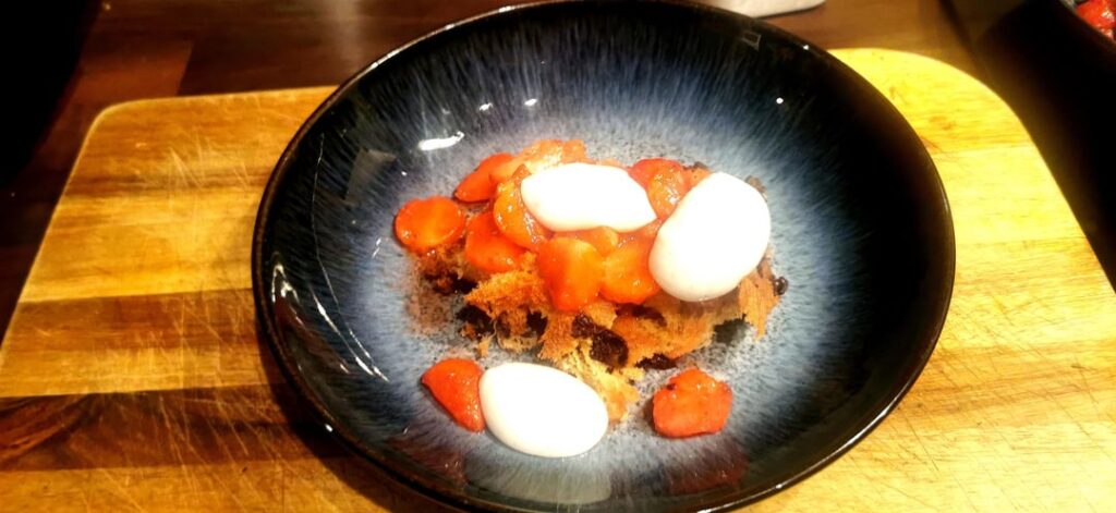 Working on reverse spherification dessert (sodium alginate bath process) - Greek Yoghurt, honey, black pepper and tahini spheres with lemon and sugar strawberries on a chocolate chip sponge