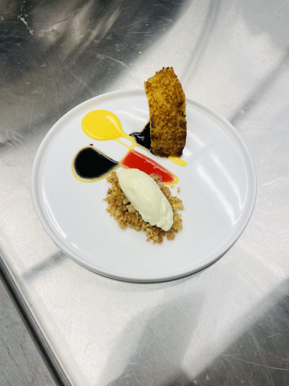 Rosemary Toasted Lemon Cake, Basil Ice Cream, Shortbread Crumble, Orange Curd, Blueberry Balsamic Coulis, Raspberry Coulis