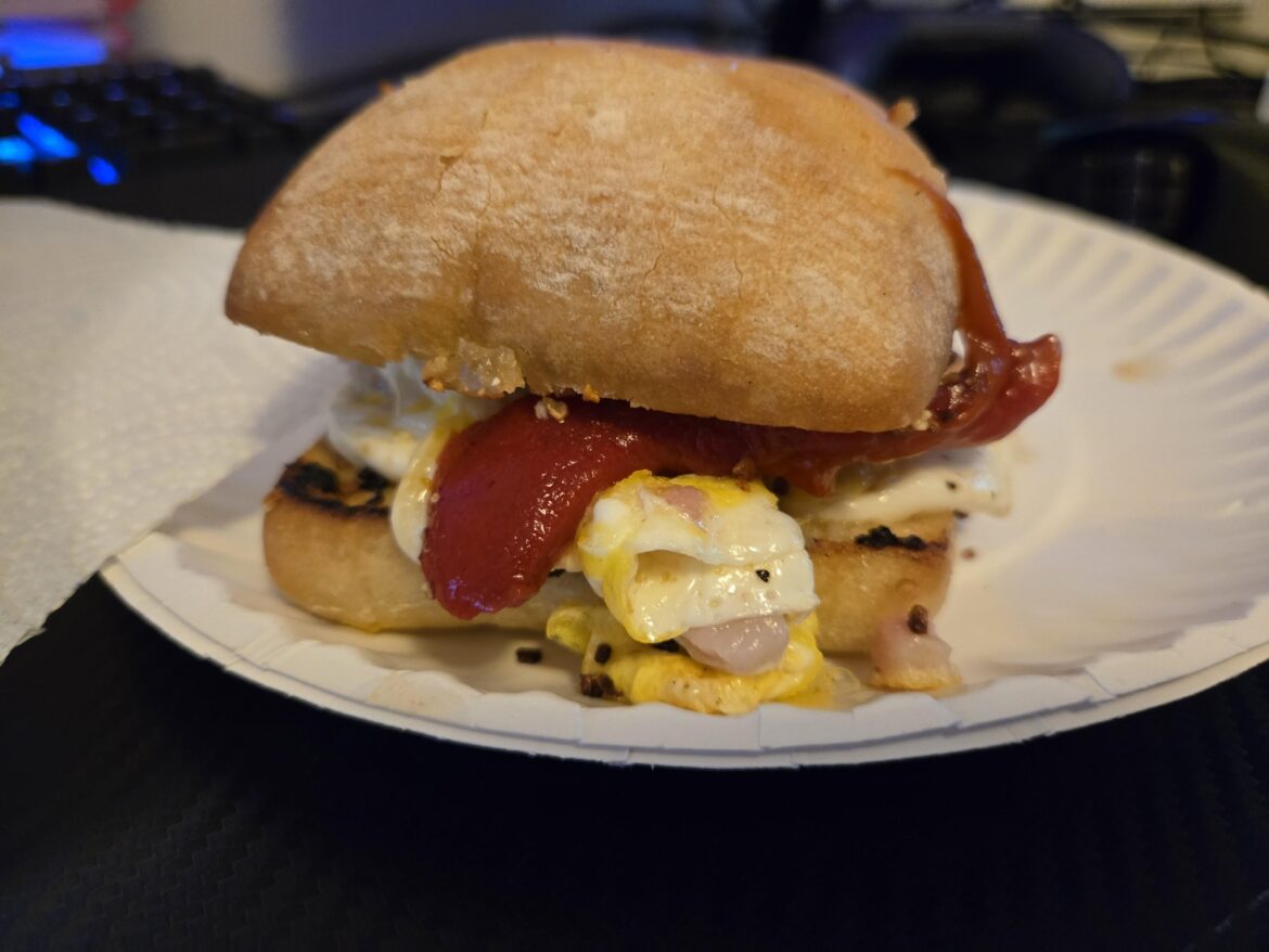 Pancetta, egg, mozzarella, roasted red pepper on ciabatta toasted in garlic butter