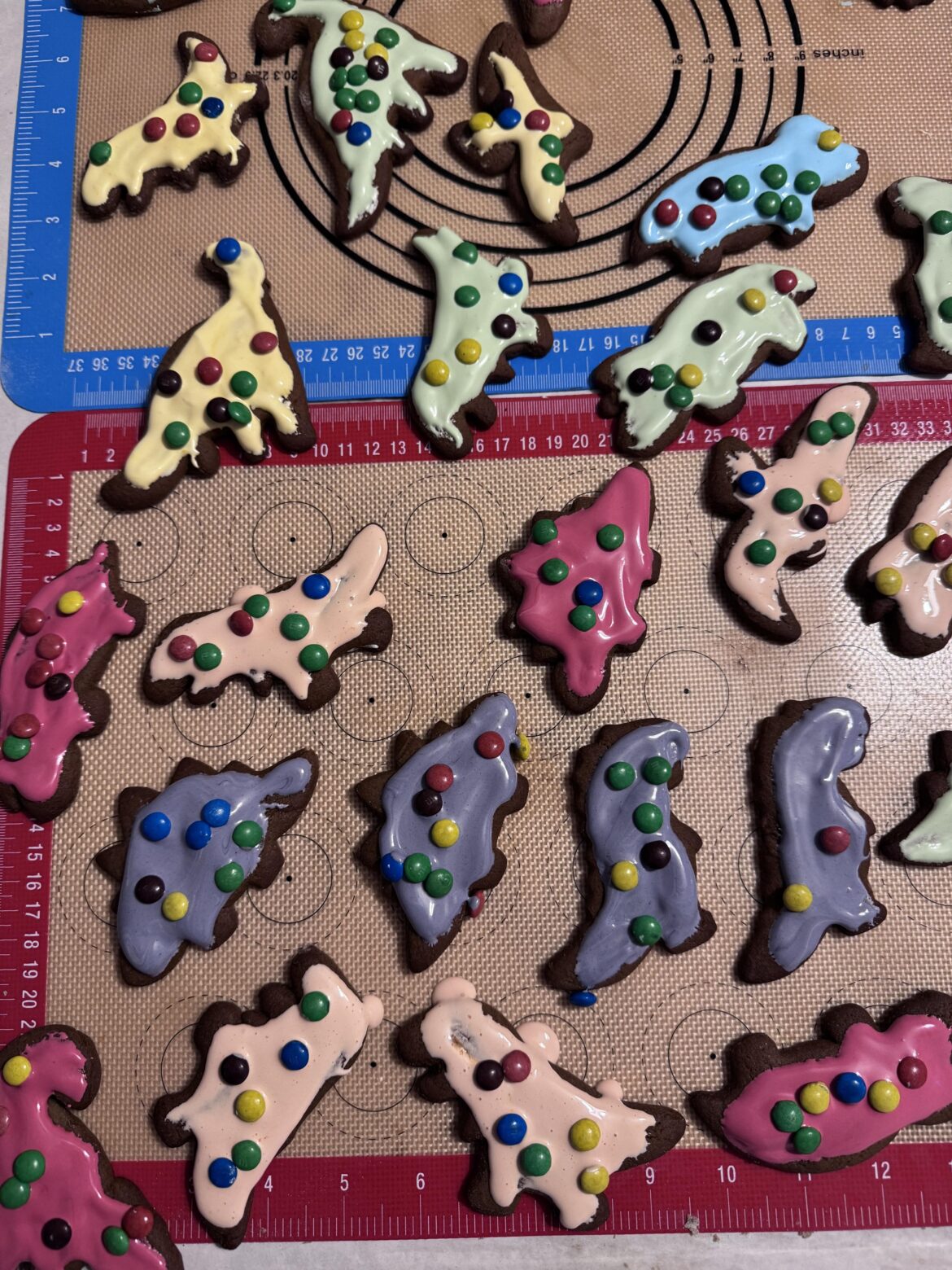 Dear cookie decorators: You are all so talented! This is my first try with my 3-year old son. They are Christmas dinosaurs.
